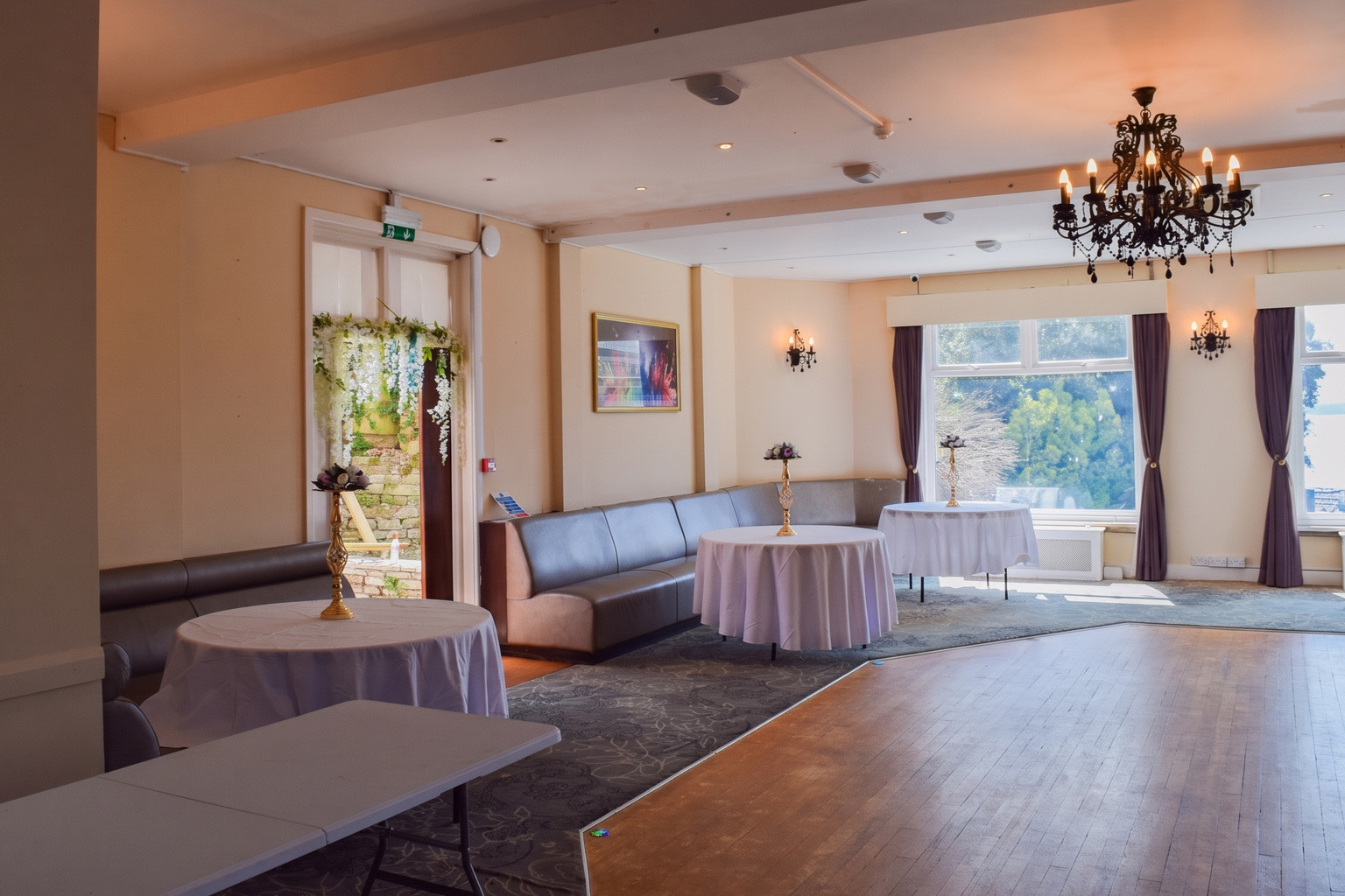 The function room at Ashbury Lounge from the far end, looking toward the side doorway