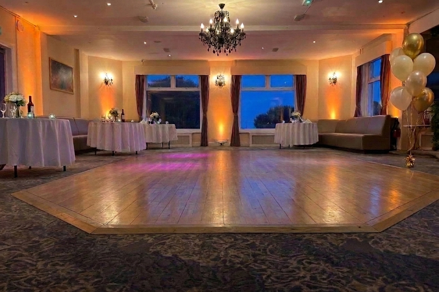 The dance floor at Ashbury Lounge lit for an evening party